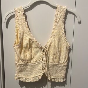 Cream Sleeveless Top with Lace-Up Detail